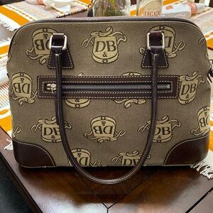 Classic Dooney & Burke purse in signature fabric DB with brown leather trim.